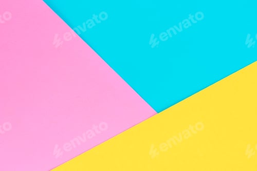 Preview: Yellow, pink and purple colored paper. Geometric empty paper background of three tones for copy