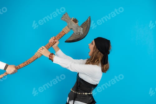 Preview: Angry young girl against ax with bare hands