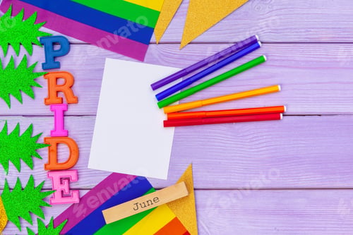 Preview: Gay pride flag on wooden table