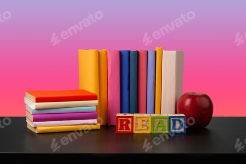 Preview: Stack of books on black wooden table