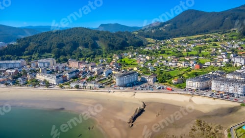 Preview: Aerial view of covas beach embracing the charming town of viveiro in galicia