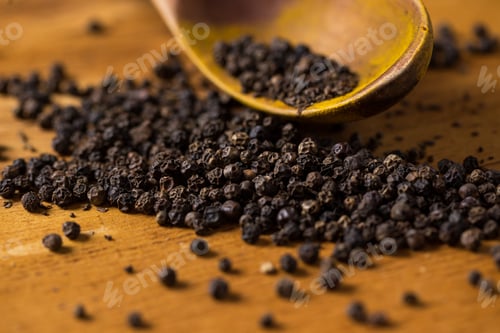 Preview: Spoon and heap of pepper on the table