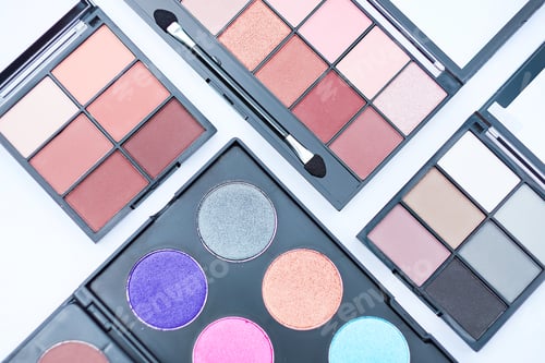 Preview: palettes with blue eye shadows isolated on white background. banner for advertising comets.