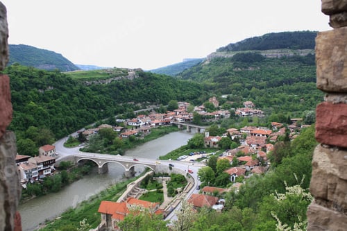 Preview: View from above of small town, bridge and river