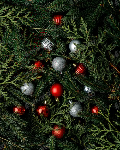 Preview: Fir branches with decorations, red and silver Christmas baubles arranged in the shape of a tree