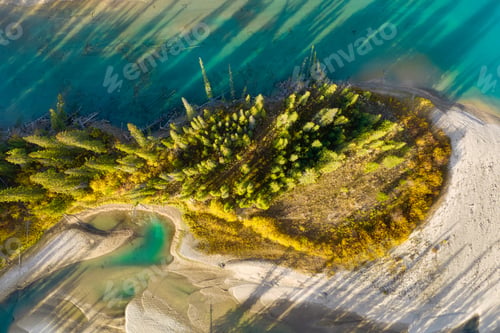 Preview: A drone view of the river in the woods. An aerial view of an autumn forest. Winding river among the