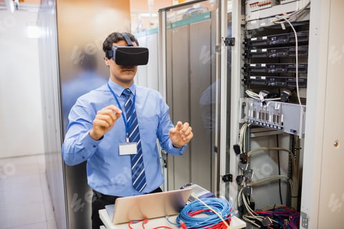 Preview: Technician Using Visual Reality Headset In Server Room