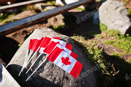 Preview: Canadian flags on stone outdoor. Canada flag.