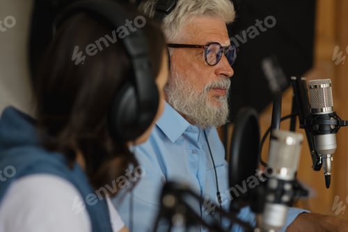 Preview: happy radio hosts recording their voice for an audio book, modern man
