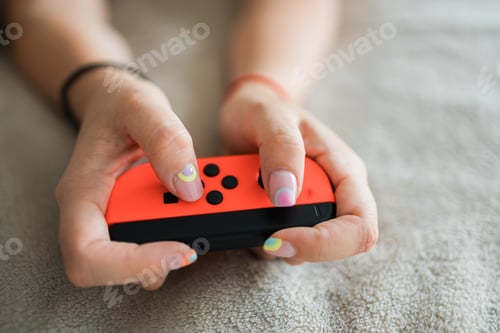 Preview: Hands using game controller. Playing video games