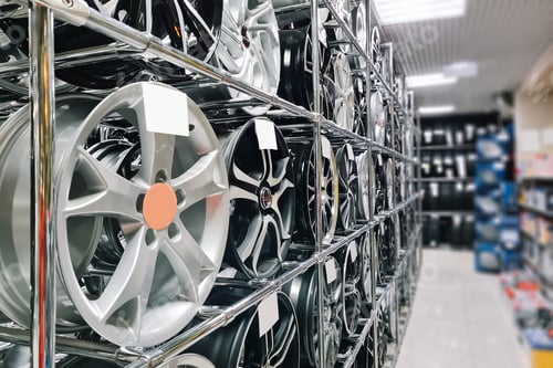 Preview: Auto shop selling car rims. Stand for sale of alloy wheels. Discounts at auto parts store.