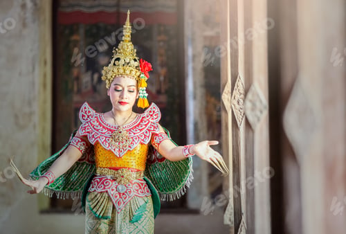 Preview: Portrait of Thailand dancer in Kinnaree costume dancing against the temple wall