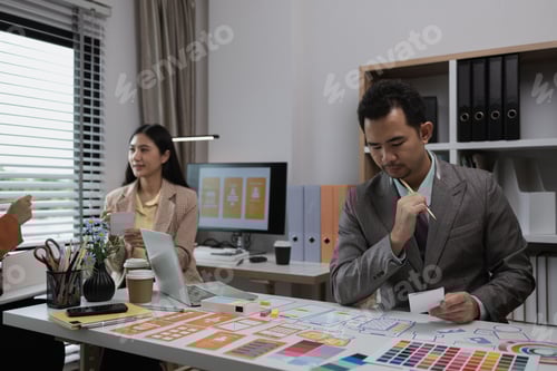 Design Team Meeting in Office Discussing App Design