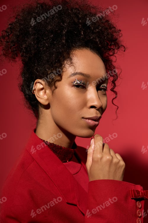 Preview: Portrait of a young woman with radiant beauty and a vibrant red backdrop showcasing her charisma
