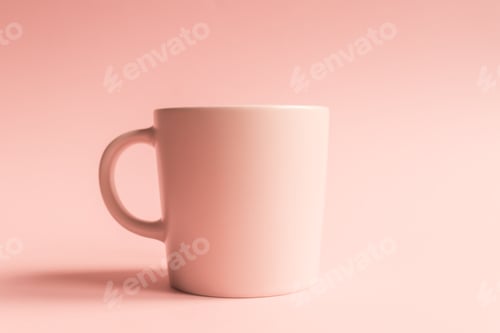 Preview: Pink ceramic cup on pink background with copy space. Monochrome color