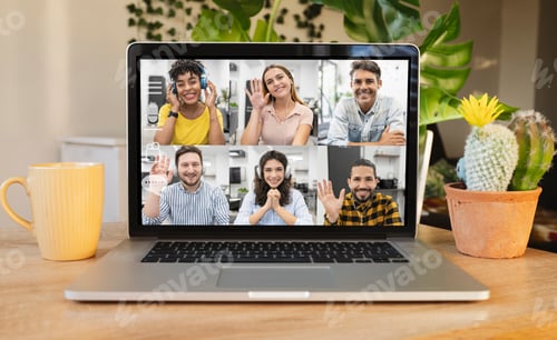 Preview: desk with laptop using online video chat service at workplace