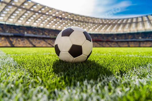 Preview: close up view of soccer ball on grass on soccer field stadium