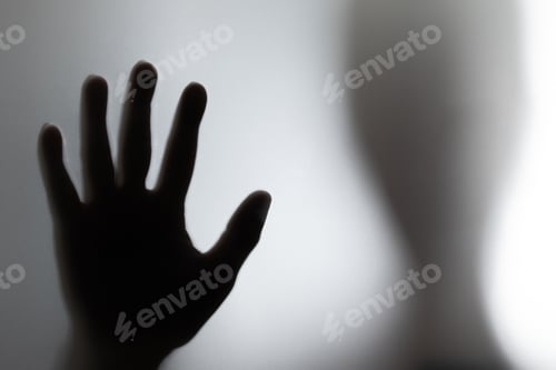 Preview: the silhouette of a person behind a frosted glass screen