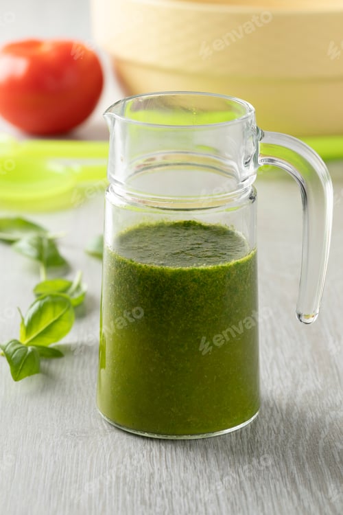 Preview: Glass can with homemade basil oil close up