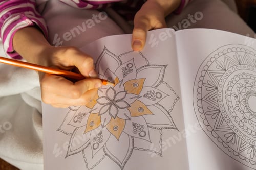Preview: Female painting mandalas antistress page to combat stress. Relaxing hobby mental wellbeing and art