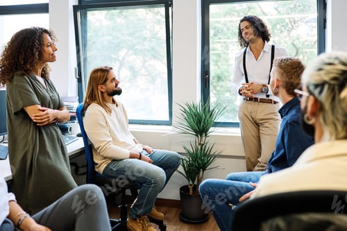 Preview: Coworkers chatting relaxed on a work break