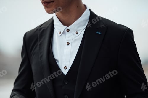 Preview: Portrait of authentic candid brunette man in business black suit