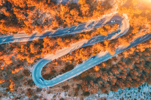 Preview: Aerial view of mountain curve road with cars, autumn forest