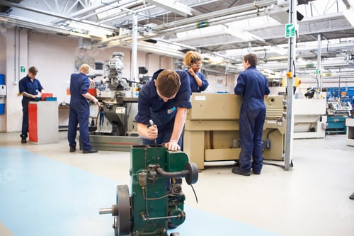 Preview: Male student sharpening tools in college workshop