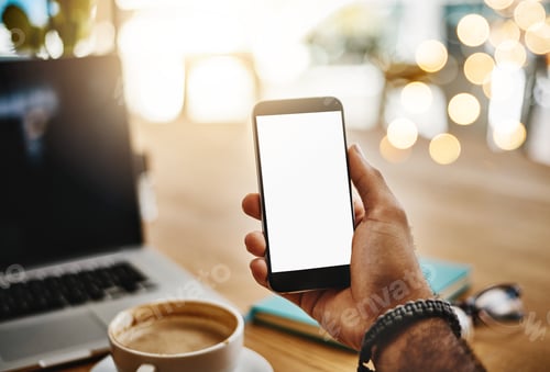 Preview: Closeup shot of an unrecognizable man holding up a cellphone with a blank screen in a cafe