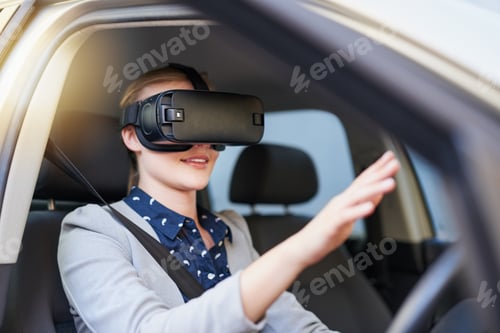 Preview: Cropped shot of a young businesswoman driving while wearing a virtual reality headset