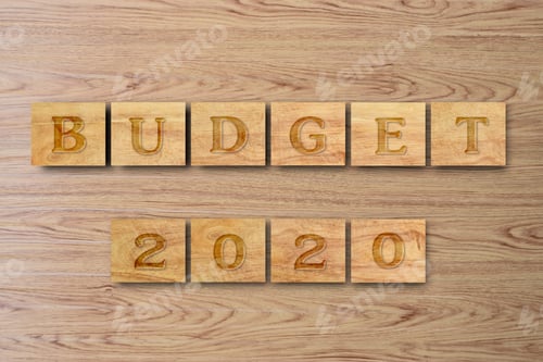 Preview: Budget 2020, the inscription wood blocks, on a wooden background. New Year Budget Concept.