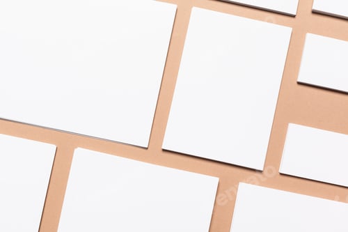 Preview: Different sizes of blank sheets on a flat surface during daylight hours