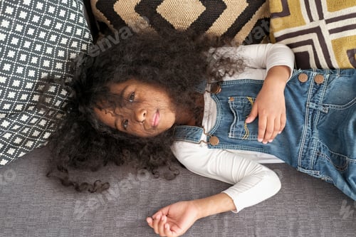 Preview: The African American Child Looks Directly Into The Camera In The Children'S Room.