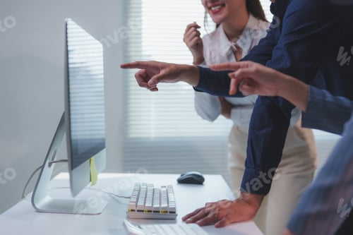 Preview: Business team analyzing data on desktop computer in office