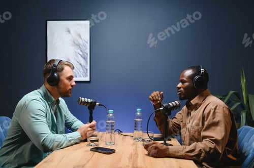 Preview: Podcast presenter having live discussion with man, streaming it for audience