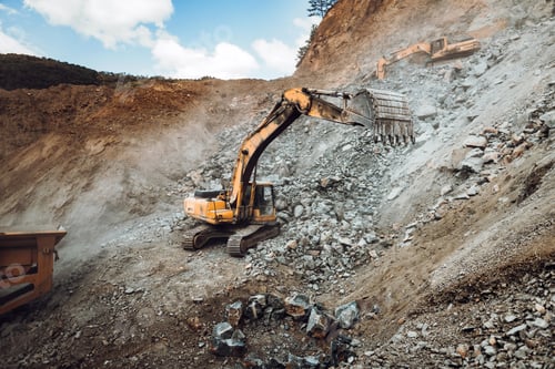 Preview: details of industrial track type excavator digging and loading ore in a dumper truck