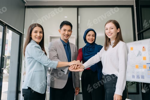 Preview: Business partnership handshake concept.Photo Multiracial team coworkers handshaking process.