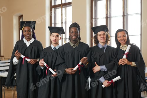 Preview: Group of people in graduation gowns and caps