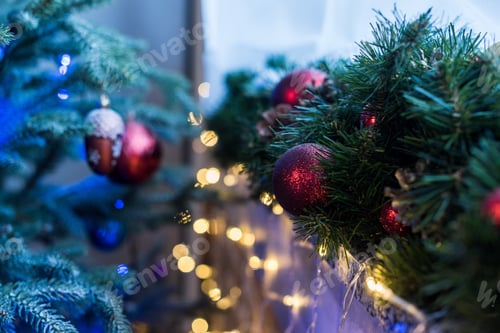 Preview: close-up view of beautiful decorated christmas tree with shiny red baubles