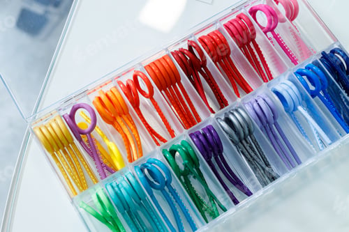 Preview: Colored elastic orthodontic bands for braces. Dentistry. Orthodontic treatment of teeth.