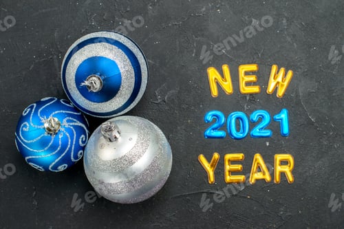 Preview: top view christmas tree toys with and new year writings on dark background holiday color photo new