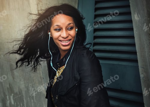 Preview: African American woman is listening to music