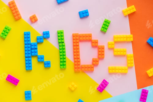Preview: Kids spelled word with plastic blocks background