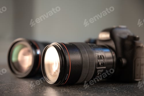 Preview: Close up in focus lens on the body of a professional digital camera copy space.