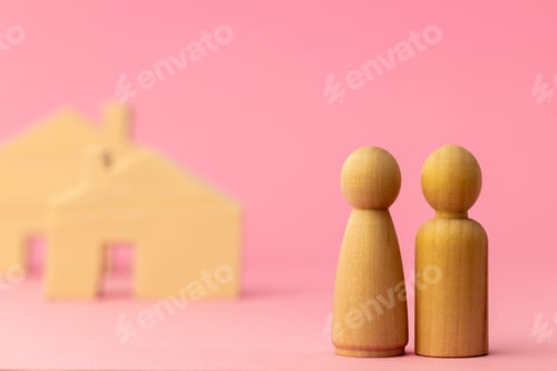 Preview: Wooden house miniature and toy people on pink background