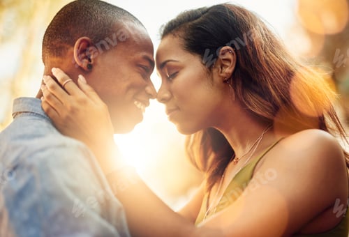 Preview: Shot of an affectionate young couple sharing a tender moment outdoors