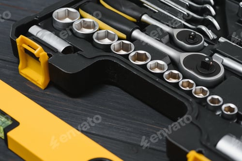 Preview: New square black tool box on wooden texture background. Top view.