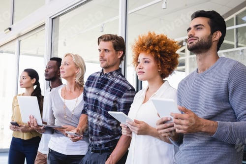 Preview: Thoughtful business people with different technologies