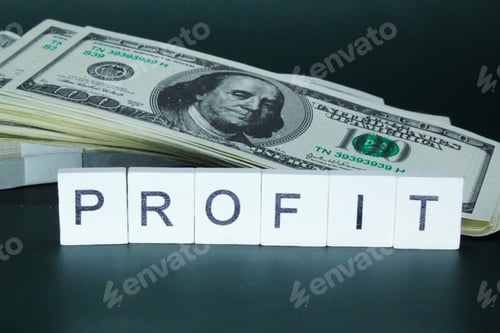 Preview: paper money with the word profit. the concept of profit or income