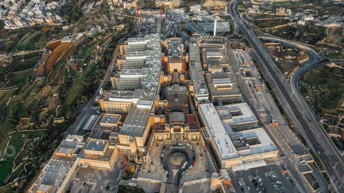 Preview: Aerial shot of Mater Dei Hospital in Malta surrounded by other buildings